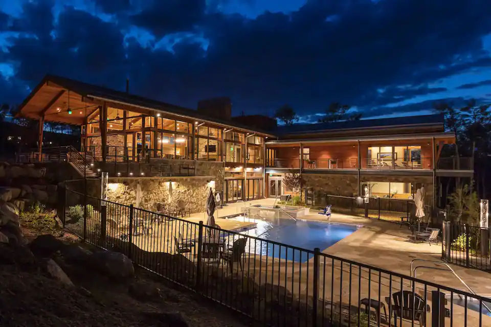 Summit Sky Ranch Aspen House clubhouse at night