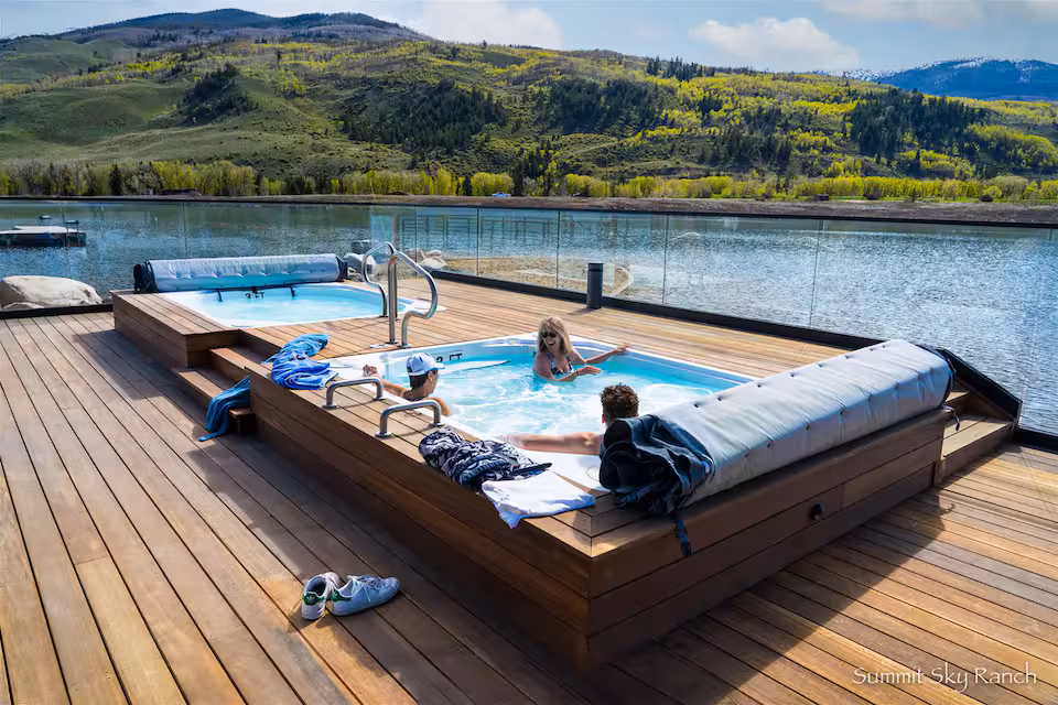 Lake House hot tub on the dock with mountain views